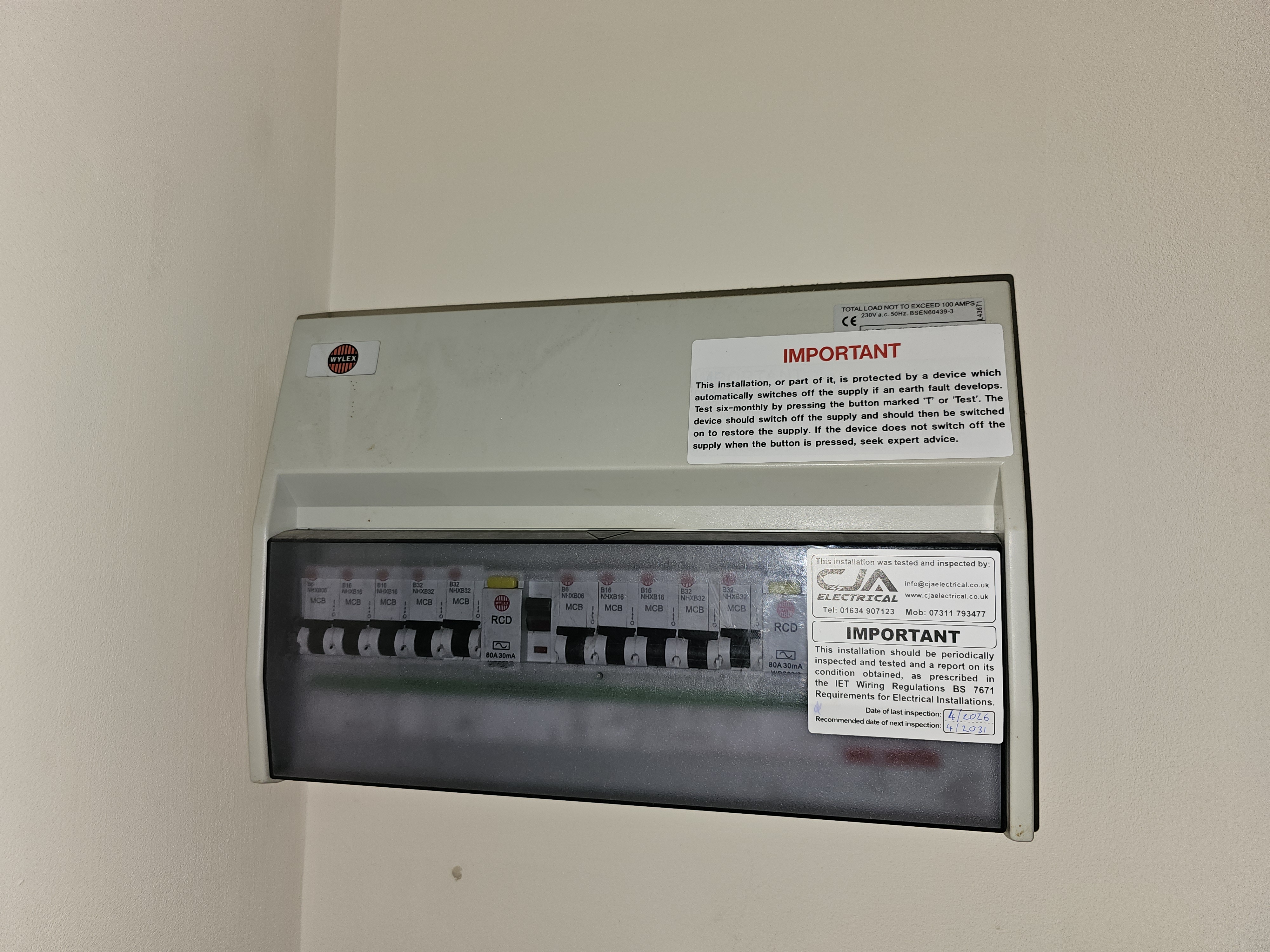 Domestic consumer unit with CJA Electrical inspection sticker on completion